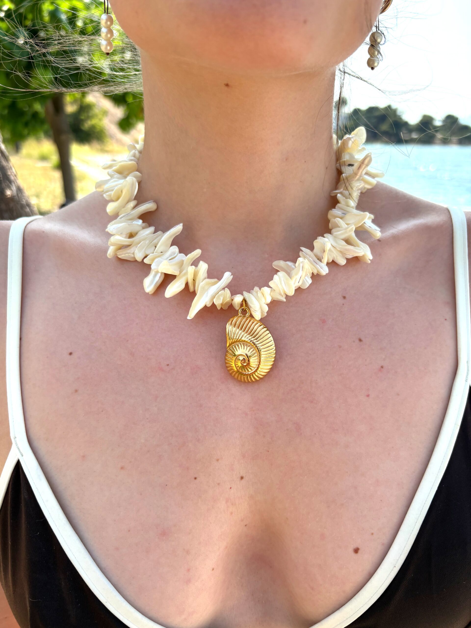 necklace with chips and big shell charm