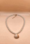 necklace with pearls and shell centerpiece