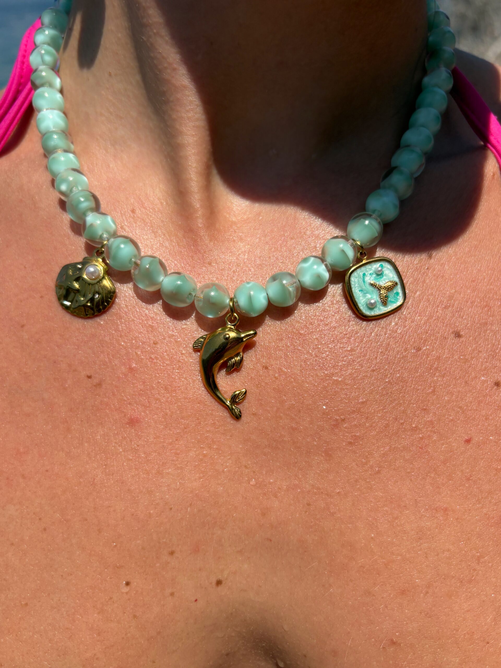 Handmade Necklace With Aqua Beads and golden charms