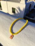 Handmade Necklace with yellow glass beads and stainless steel centerpiece