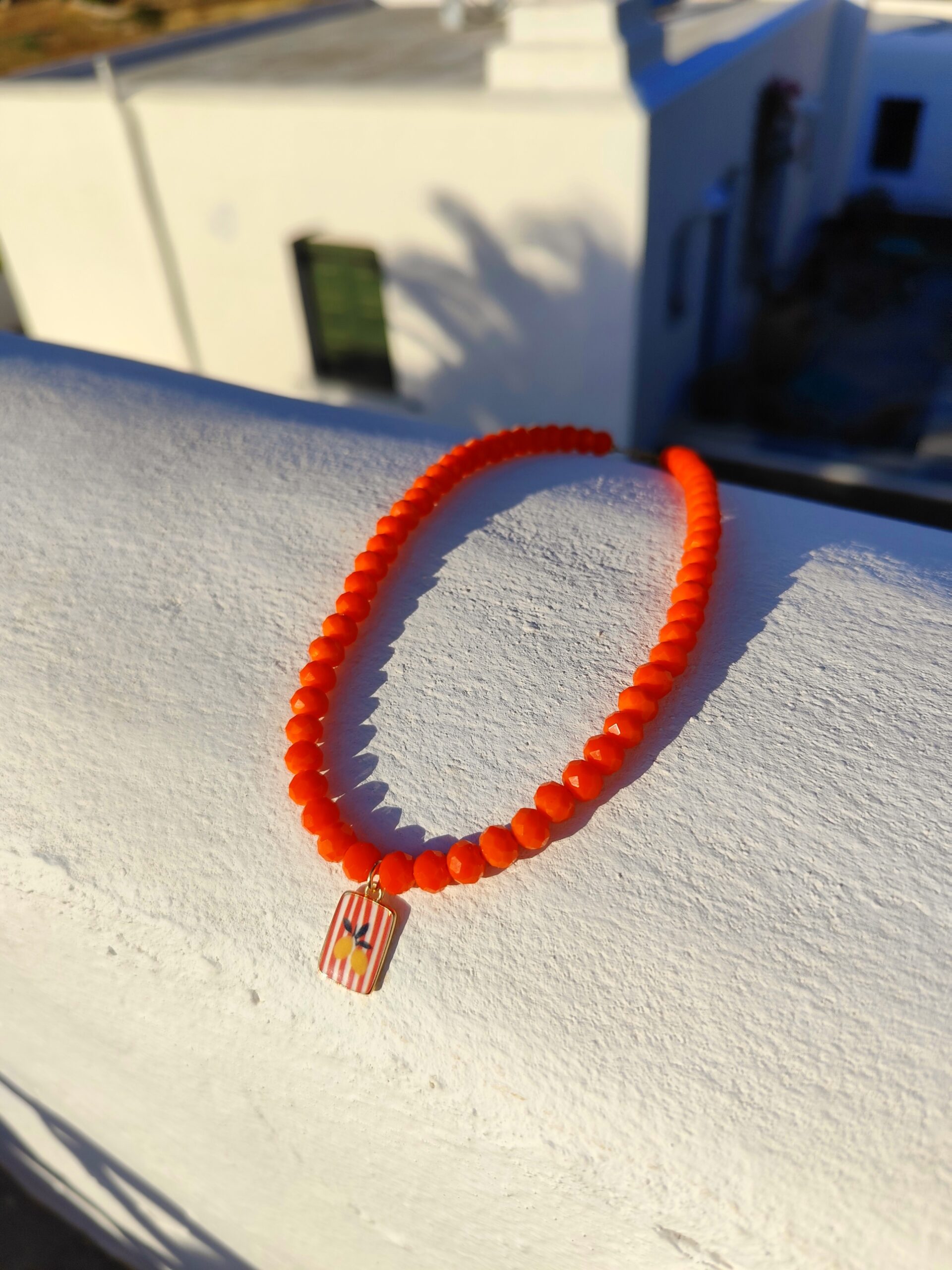 Handmade Necklace with orange glass beads and stainless steel centerpiece